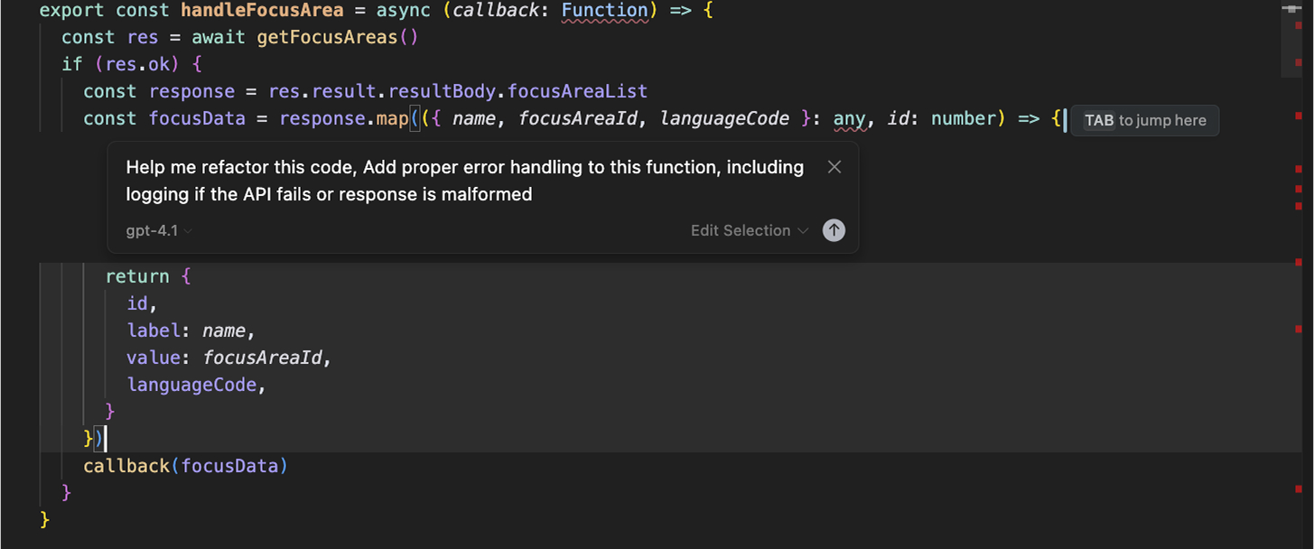 Cursor Cmd+K inline code editor prompting to add error handling and API failure logging to handleFocusArea async function